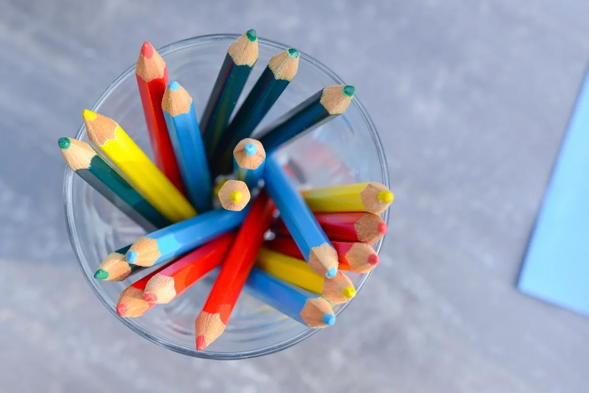 Crafts activities for students with colored pencils and art supplies